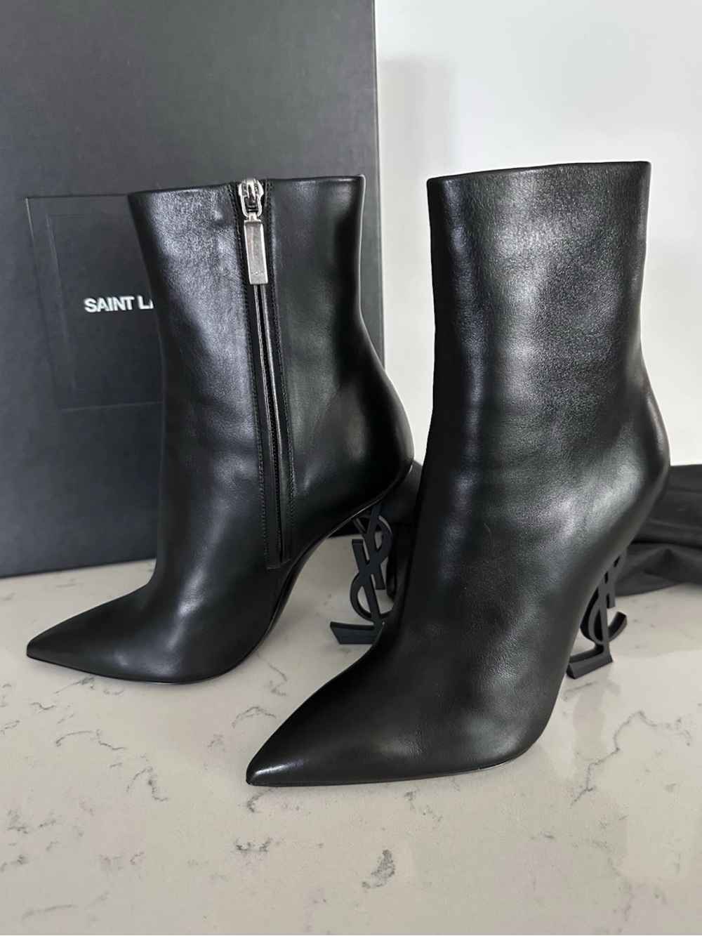 Saint Laurent EU 38 Black Leather Pointed Ankle Boots with Sculptural Logo Heels
